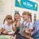 A family of 4 enjoys ice cream outside of Boardwalk Ice Cream in Walt Disney World Resort