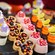 An assortment of bite sized desserts featuring a Mickey Mouse theme