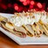 A plate of crepes topped with whipped cream, bananas and nuts, at Chef Mickey’s