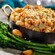A small pot of macaroni and cheese served with broccoli and roasted garlic, from Coral Reef Restaurant at Epcot