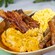 A breakfast platter from The Crystal Palace with eggs, bacon, sausages and cheesy potatoes