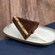 A triangle shaped cake pop served on a plate