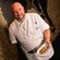 Chef Chris Edwards of Capa at Four Seasons Resort Orlando at Walt Disney World Resort holds a seafood dish