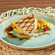 Grilled fish fillet with edamame, roasted tomatoes and citrus sauce