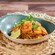 Shrimp pad thai with rice noodles, crushed peanuts, fresh basil and a lime wedge