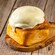 A Cinnamon Roll with Orange Cream Cheese Icing from Kringla Bakeri Og Kafe at Epcot