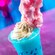 An Electric Slushy drink topped with whipped cream and cotton candy from FØØD by Swedish Chef