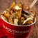 Montreal Viande Fumée poutine with french fries, cheese curds, smoked meat, pickles, and mustard gravy