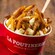 Quebec L’authentique poutine in a cup with cheese curds and gravy