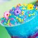 Bluey's Berry Lemonade topped with colorful sprinkles and candy flowers