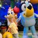 Bluey, Bingo and children play with balloons 