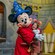 Sorcerer´s Apprentice Mickey Mouse hugging a young Guest in Meet Disney Stars at Red Carpet Dreams