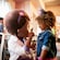 A little girl in Minnie Mouse ears meets Doc McStuffins in a restaurant
