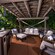 Beachcomber Shack Premium Plus seating area with cushioned chairs, towels, TV and mini fridge