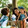 A mom and 2 kids sharing an ice cream sundae at Disney's Typhoon Lagoon water park