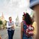 A VIP Tour Guide and Guests walking down Main Street, USA with Cinderella Castle in the distance