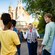 A VIP Tour Guide approaching the Haunted Mansion in Magic Kingdom park with Guests