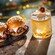 Three roast beef sliders on seeded buns beside an amaretto sour cocktail from Hurly Burly at Disney’s Boardwalk