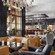 The interior of Capa featuring a bar and floor to ceiling windows