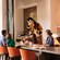 Goofy greets a family at their table during a meal in Ravello at the Four Seasons Resort Orlando
