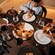 A family sharing a pizza in Ravello at the Four Seasons Resort Orlando