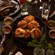 A table with a platter of bread, a steak and wine in Ravello at the Four Seasons Resort Orlando