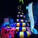 A snake coiled next to wrapped gifts and a naughty and nice list at Haunted Mansion Holiday