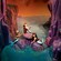 Three mermaids relaxing at the base of a waterfall at Peter Pan’s Flight