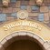 An entrance sign that reads ‘Snow White’s Enchanted Wish’ above an archway at Disneyland Park in California