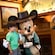 A little boy smiles as he is greeted by Mickey Mouse and Minnie Mouse at Disneys Grand Californian Hotel and Spa.