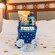 A Disneyland Resort 70th Celebration welcome basket on a Disneyland Resort hotel bed