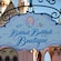 A shop sign for Bibbidi Bobbidi Boutique featuring Cinderella