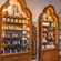 Three wooden display shelves holding fragrances and personal care items inside of Il Bel Cristallo at Epcot