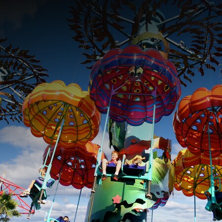 Beneath the whimsical Jumpin' Jellyfish parachutes, Guests soar over Paradise Pier