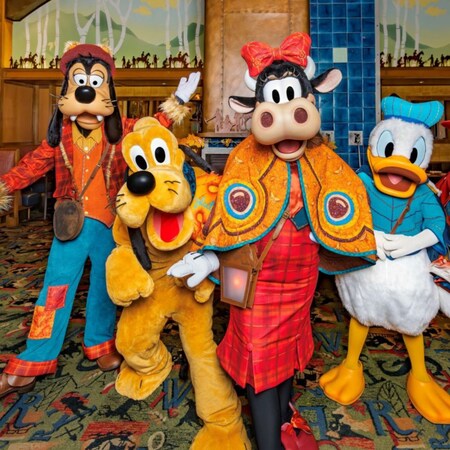 Goofy, Pluto, Clarabelle Cow, Donald Duck and Daisy Duck dressed for Halloween at Storytellers Cafe