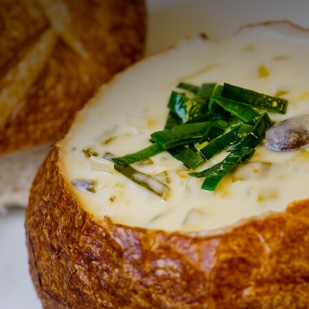 A bread bowl with soup in it