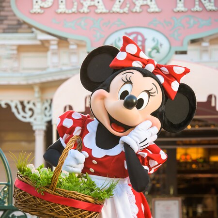 Minnie Mouse carries a basket and strikes a cute pose