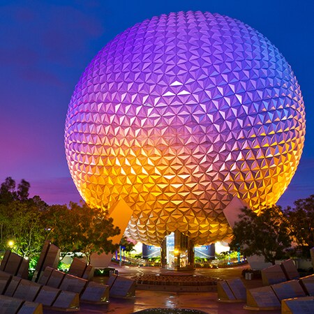 Spaceship Earth at night, next to Leave a Legacy Plaza at Epcot