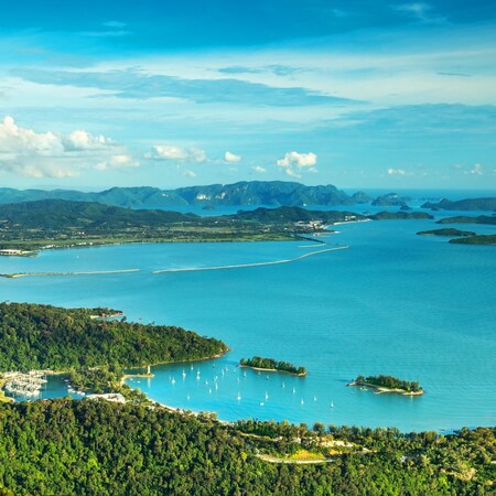 View of tropical island Langkawi and cable car in Malaysia, covered with tropical forests as seen from the sky bridge