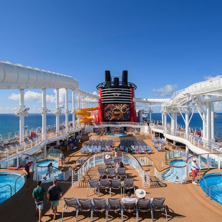 The top deck of the Disney Fantasy ship with pools, lounge chairs and the AquaDuck water coaster