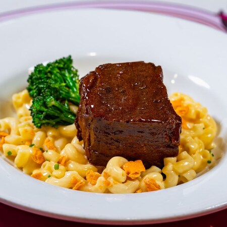 A plate of Braised Short Rib served with macaroni and cheese and broccoli from Carnation Café