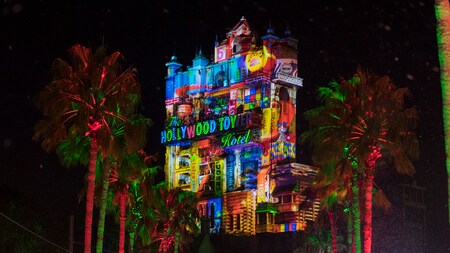 Festive holiday projections on The Hollywood Holiday Tower Hotel during the Christmas season