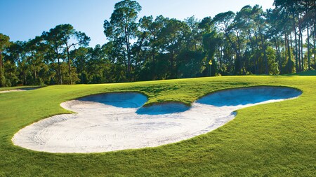A bunker in the shape of Mickey Mouse on the Magnolia Golf Course