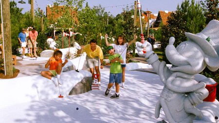 A family plays a round at Winter Summerland Miniature Golf Course	