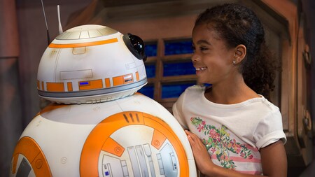 A young female Guest meets BB-8 inside ‘Star Wars’ Launch Bay at Disney’s Hollywood Studios
