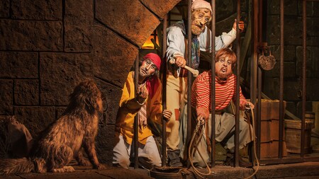Audio-Animatronic pirates beg for canine assistance during Pirates of the Caribbean in Adventureland