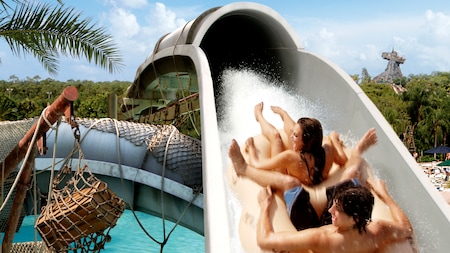 Two people ride the Crush n Gusher at Disney’s Typhoon Lagoon water park
