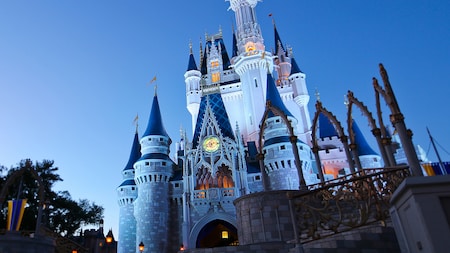 Cinderella Castle towering into the evening sky above Magic Kingdom park at Walt Disney World Resort