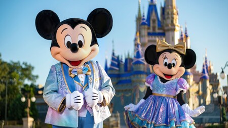 Mickey Mouse and Minnie Mouse, wearing sparkling new looks for The World’s Most Magical Celebration in honor of Walt Disney World Resort's 50th anniversary.