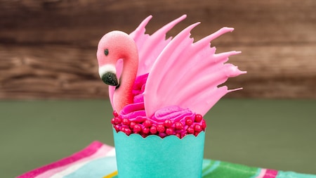An edible flamingo atop a strawberry cupcake with strawberry filling at Flame Tree Barbecue in Disney’s Animal Kingdom theme park